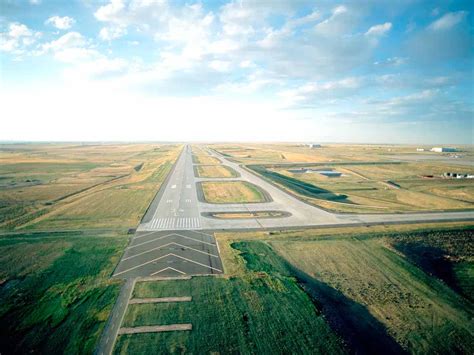 Denver International Airport runway 16R 34L long strip aerial Rocky Mountains horizon