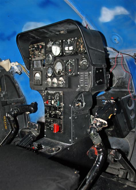 Detailed cockpit view of the Hughes OH-6A, highlighting instrumentation and crew seating