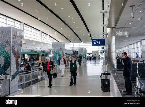 Detroit Metropolitan Wayne County Airport terminal bustling with international travelers