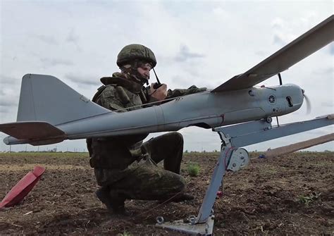 Digital camouflage and kill markings on Ukrainian Yak-52 anti-drone aircraft