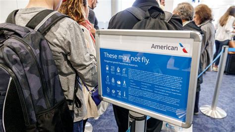 Disgruntled passengers at an American Airlines gate following unexpected seating changes