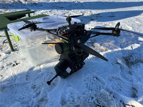 DJI FPV drone in mid-race over coastal terrain