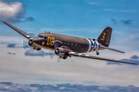 douglas c-47 skytrain dropping paratroopers over france