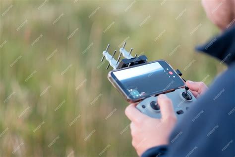drone controller and smartphone live fpv view outdoors