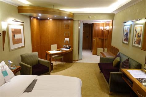 Dubai Connect hotel room interior with king bed and welcome amenity