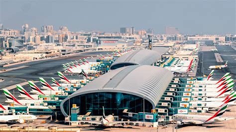 Dubai International Airport terminal with Emirates aircraft at gates