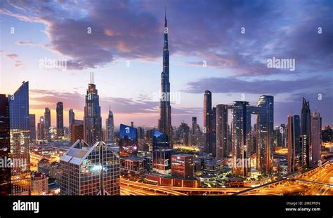 Dubai skyline at sunset with Burj Khalifa and financial district towers