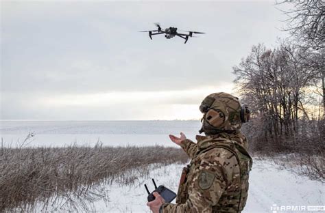 Dutch and Ukrainian engineers reviewing joint UAV production facility plans