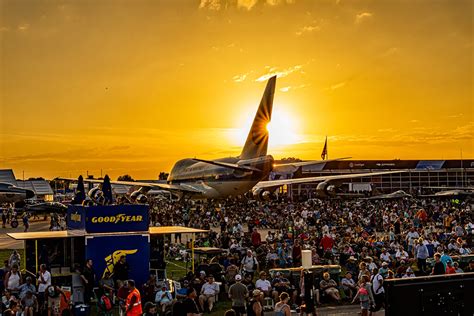 EAA aircraft on tarmac during fly-in event with sponsor banners