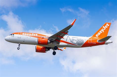 easyJet Airbus A320neo departure from Paris Charles de Gaulle alongside Air France long-haul aircraft