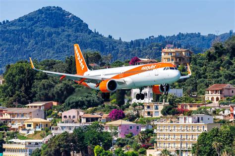 easyJet Airbus A321neo aircraft landing at major European airport terminal