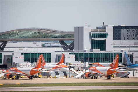 EasyJet aircraft lined up at London Gatwick Airport gates