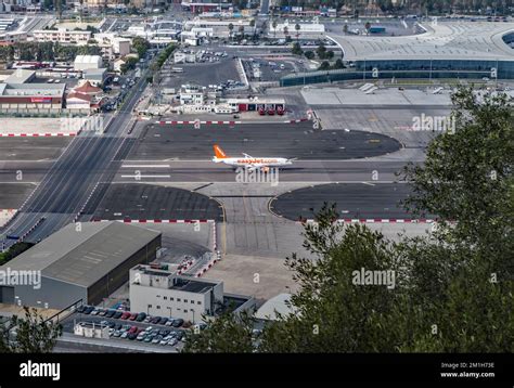 easyJet aircraft taxiing past terminal with investors watching from observation deck