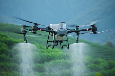 eco-friendly commercial drone spraying purified water on glass facade