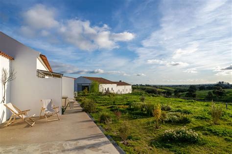 eco-friendly guesthouse surrounded by terraced farmland and local trees on Greek island