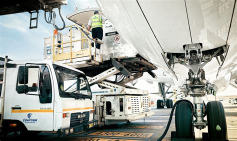 EgyptAir ground crew overseeing dismantling operation under supervision of aviation engineers