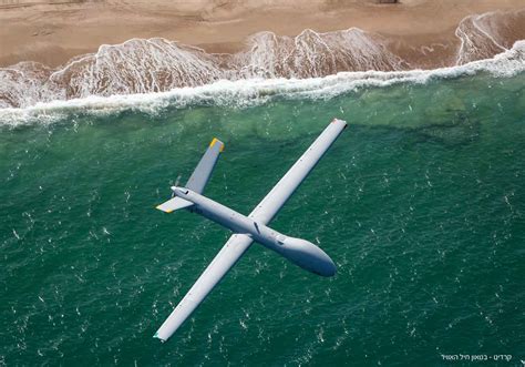 Elbit Hermes 900 MALE UAV on tarmac with ground crew in Israel