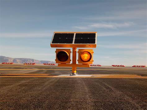 elevated runway guard lights flashing yellow near hold line