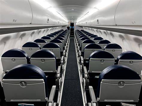 Embraer E170 cabin interior in LOT Polish Airlines configuration with 2-2 seating