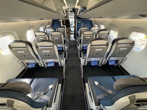 embraer e195-e2 economy cabin with 2+2 seating and large windows