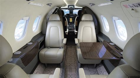 embraer phenom 100 luxurious club interior seating with full lavatory design