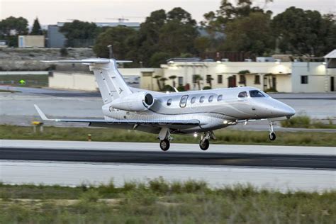 Embraer Phenom 300 private jet departing regional airport