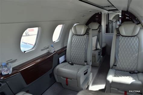 embraer phenom 300e interior with leather seating and executive layout