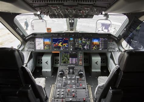 Embraer’s KC-390 cockpit showcasing modern avionics and multi-role system interface