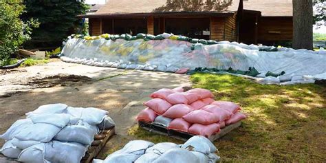 emergency flood crew installing sandbags outside homes in Shrewsbury