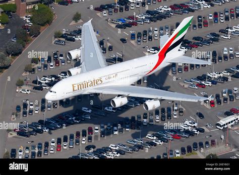 Emirates A380 aircraft in flight over Dubai skyline