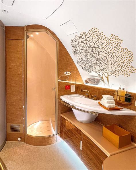 Emirates A380 onboard shower spa luxury bathroom suite gold accents