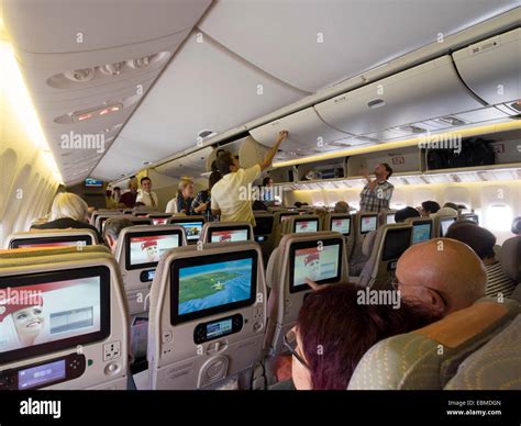 Emirates Boeing 777 cabin filled with passengers during boarding