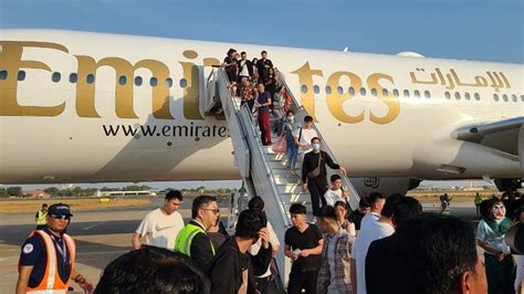Emirates Boeing 777 fifth freedom flight boarding international passengers