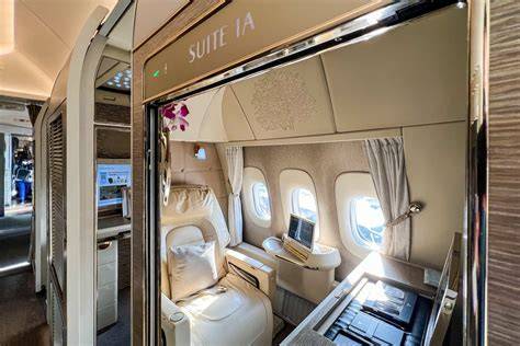 Emirates Boeing 777 first class private suite floor-to-ceiling doors personal minibar 2026