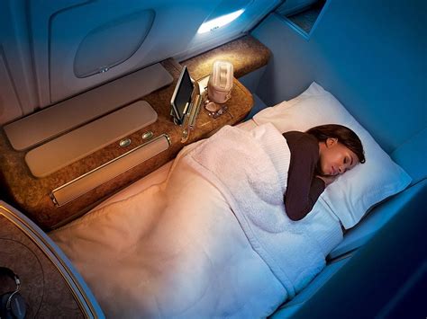 Emirates business class fully flat bed with luxury bedding setup