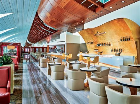Emirates business lounge Dubai champagne bar luxury interior seating
