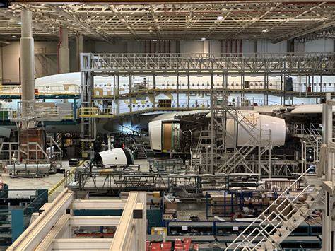 Emirates Engineering team creating Arsenal crest sculpture using recycled aircraft components