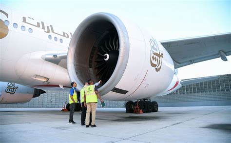 Emirates engineering team servicing a Boeing 777 engine in hangar