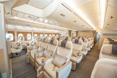 Emirates premium economy cabin with warm colors and generous legroom on Boeing 777
