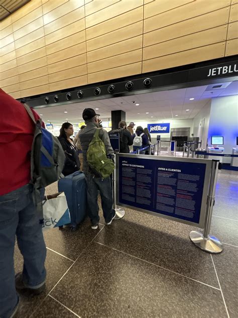 empty jetblue check-in counters at JFK terminal 5 during reduced operations