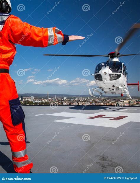 EMS helicopter departing hospital rooftop helipad