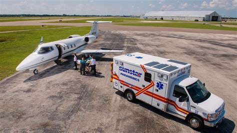 EMS helicopter pilot preflighting aircraft before medevac mission