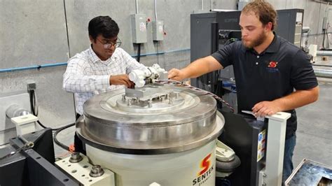 engineers conducting vibration testing on aerospace structural component at ITS lab
