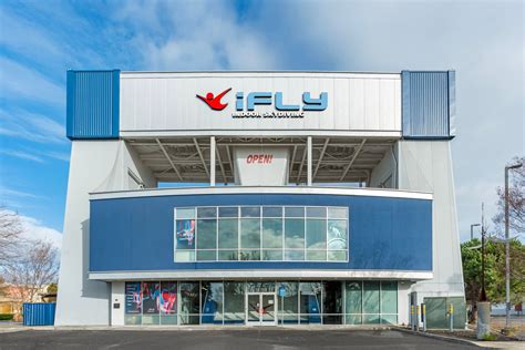 entrance sign for iFLY Indoor Skydiving Union City with nearby Texas Roadhouse visible in background