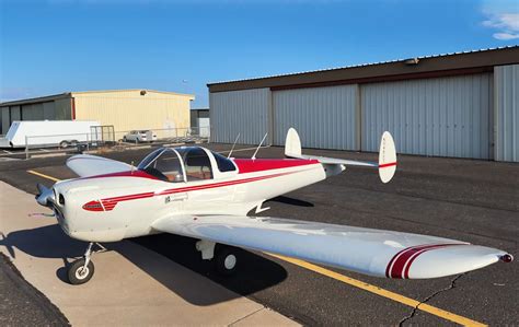 ercoupe aircraft parked with bubble canopy open and twin tail visible