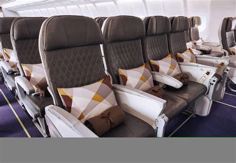 etihad economy cabin with 4k screens and usb-c charging