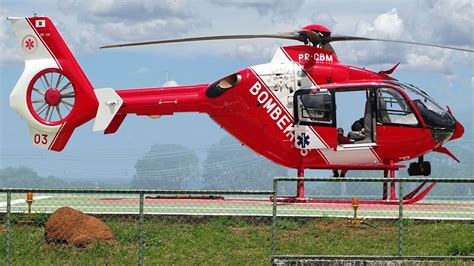 eurocopter ec135 flying over rural emergency rescue site