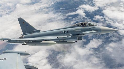 Eurofighter Typhoon Tranche 5 in flight with Leonardo branding over maritime terrain