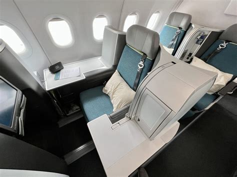 European narrowbody aircraft business class cabin with premium recliner and lie flat seats