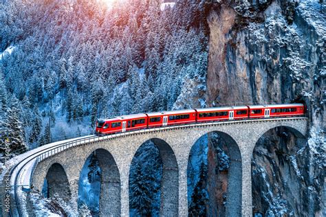 eurostar train passing through swiss alpine landscape